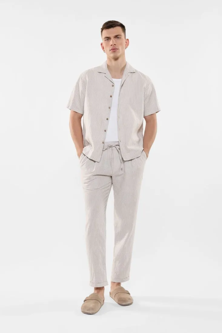 Pantaloni slim-fit fantasia gessata con coulisse e pinces
