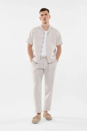 Pantaloni slim-fit fantasia gessata con coulisse e pinces