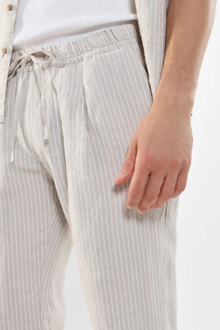 Pantaloni slim-fit fantasia gessata con coulisse e pinces